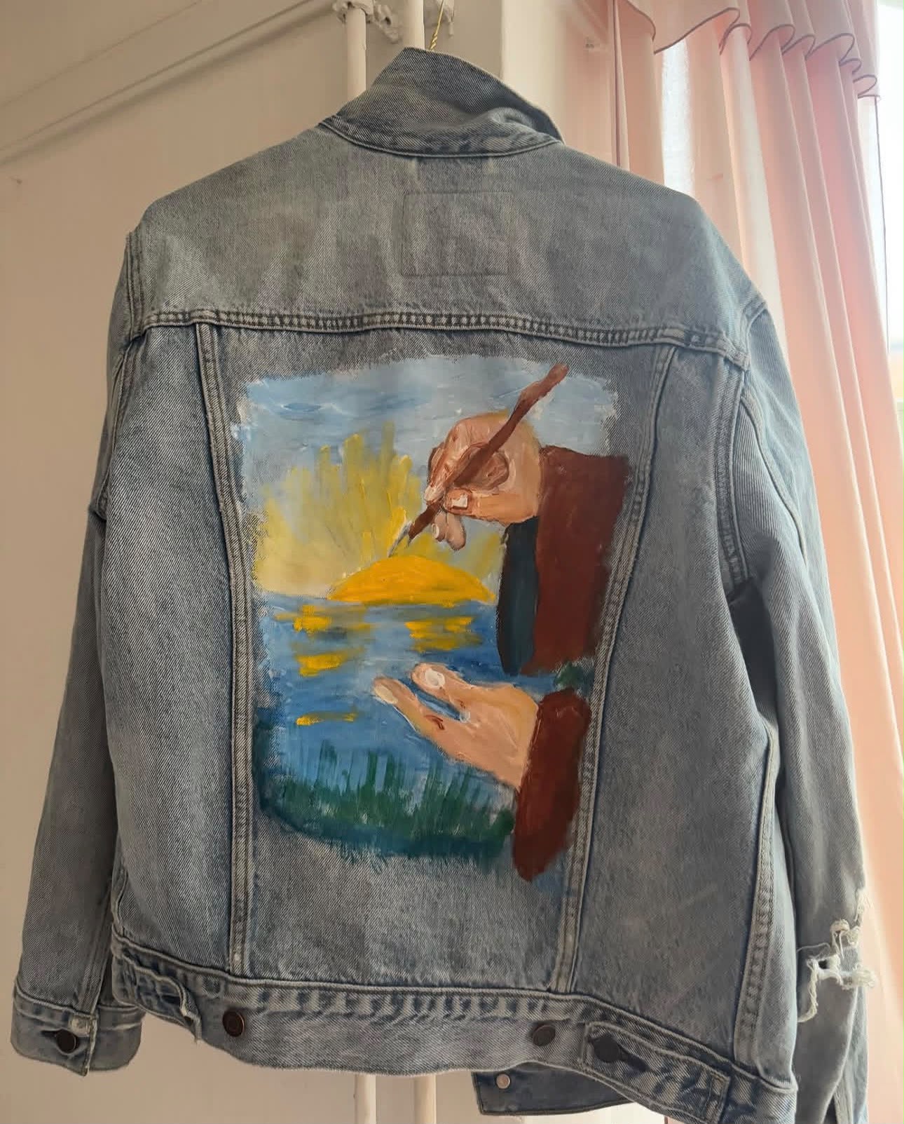Hand-painted denim jacket with sunset scene